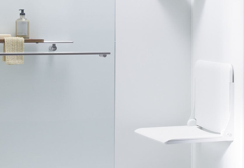 KOHLER LuxStone shower with built-in fold-down seat and storage bar in Denver, Colorado remodel